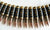 5.56 Copper Tipped Brass Bullet & Black Link Belt